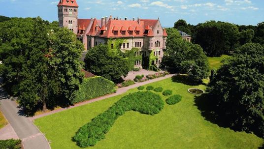 Faber-Castell castle in Stein, Germany with a big green footprint in front of it